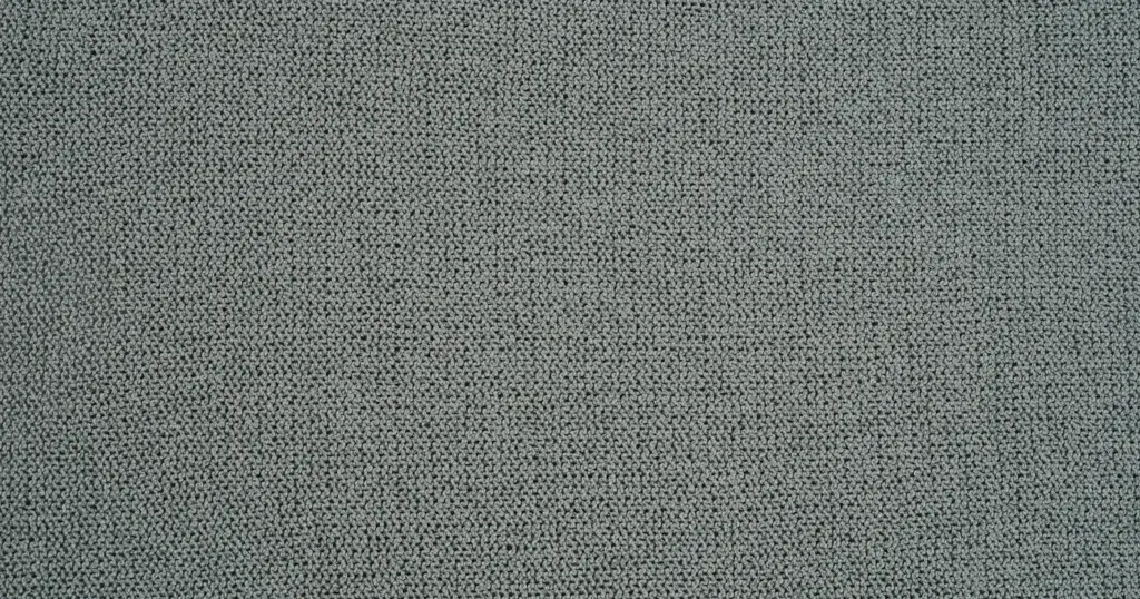 Gros plan sur la texture d’un tissu gris